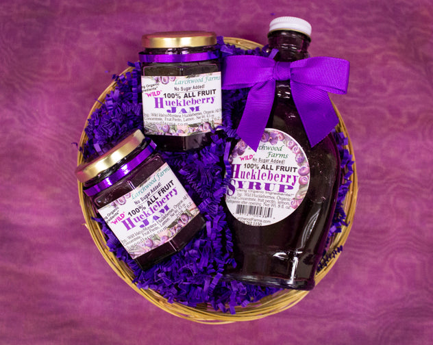 HuckleberryWow! The bold flavor of wild hucklberries crafted with organic, all fruit ingredients into flavor rick jam and syrup, beautfully packaged and arranged by Larchwood Farms.