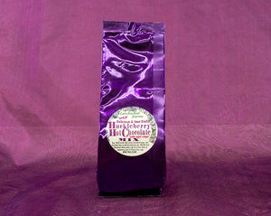 Huckleberry Hot Chocolate with mini chocolate chips beautifully packaged in purple foil bag.