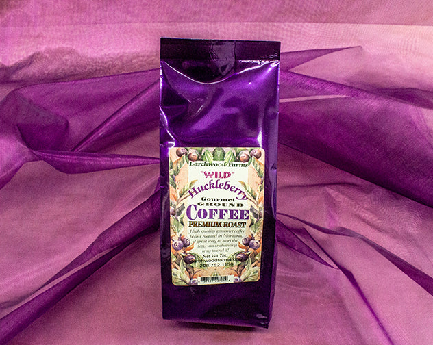 Simply divine huckleberry coffee crafted by Larchwood Farms, tucked into rich purple foil gift bags