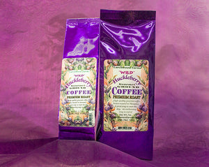 Simply divine huckleberry coffee crafted by Larchwood Farms, tucked into rich purple foil gift bags