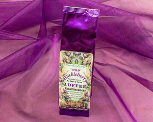 Give a bold flavor gift with pride, huckleberry coffee crafted by Larchwood Farms, tucked into a beautiful purple foil gift bag - 1.7 oz.