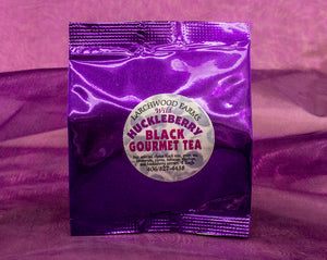 Fine huckleberry black tea beautifully packaged in a rich lustrous foil sampler 
